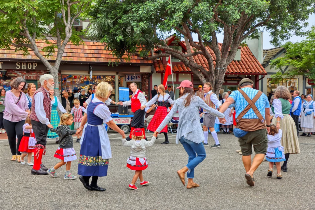 Folk dancers perform a traditional Danish circle dance in downtown Solvang during Danish Days